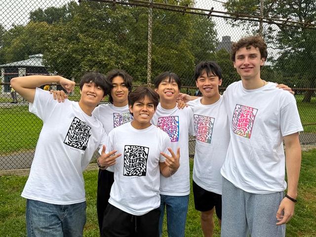Brothers outdoors in matching event shirts